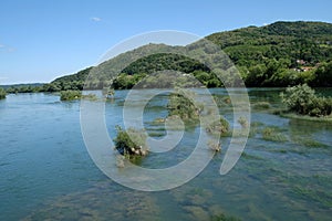 River Una on a summer day in Hrvatska Kostajnica, Croatia photo