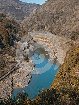 River in valley in the middle of the forest at autumn