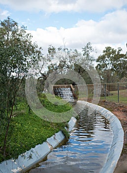 River Water Cascading into Concrete Channel.