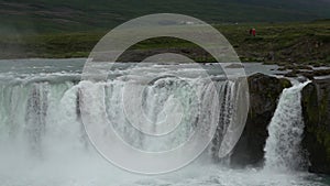 River water falls over cliff of rocks