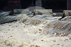 River Water Flowing Quickly Over an Overflow Dam