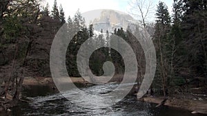 River Water Flowing Towards Camera With Halfdome In Background