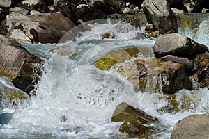 River water stream running among stones