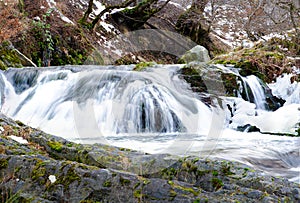 River waterfall and frozen water