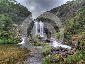 This river waterfall is a natural wonder and is hidden in nature photo