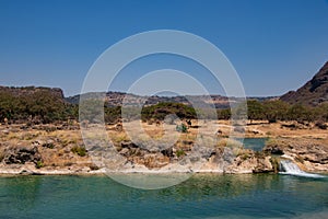 River Waterfall and pond in Wadi Darbat near Salalah photo