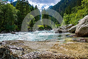 River between the waterfalls of krimml in austria