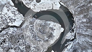 River winter floodplain snow meander delta drone aerial inland video shot in sandy sand alluvium freezing cold frost