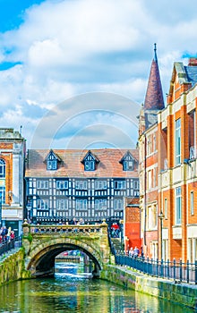 River Witham passes old brick buildings in central Lincoln, England