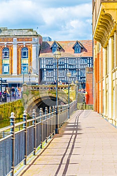 River Witham passes old brick buildings in central Lincoln, England