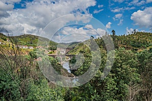 River ZÃªzere with old bridge and BouÃ§Ã£ dam in the background, PedrogÃ£o Grande PORTUGAL photo