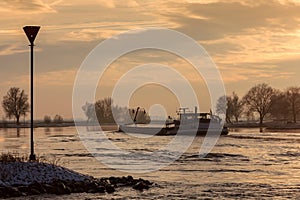 Riverboat during winter on the Dutch river IJssel