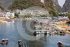 Riverboats in the tourest town of Yangshuo, Guangx, China
