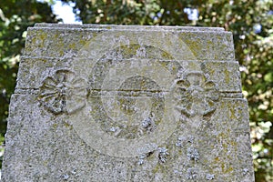 Riverdale cemetery, old leaning tomb stones in filtered light.