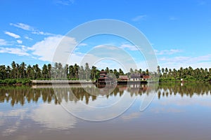 Riverfront house on sunny day