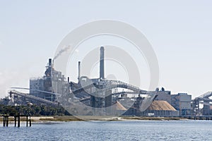 Riverfront paper mill machinery photo