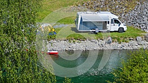 Riverfront RV Camper Van Camping with Tent and Kayaks