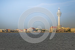 Riverfront view of Samut Prakan city hall with new observation tower and boat pier. Samut Prakan is at the mouth of the Chao