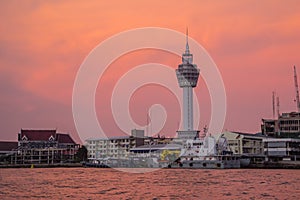 Riverfront view of Samut Prakan city hall with new observation tower and boat pier. Samut Prakan is at the mouth of the Chao