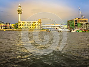 Riverfront view of Samut Prakan city hall with new observation tower and boat pier. Samut Prakan is at the mouth of the Chao