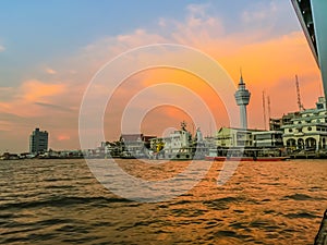 Riverfront view of Samut Prakan city hall with new observation tower and boat pier. Samut Prakan is at the mouth of the Chao