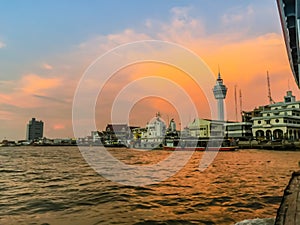 Riverfront view of Samut Prakan city hall with new observation tower and boat pier. Samut Prakan is at the mouth of the Chao