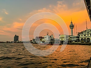 Riverfront view of Samut Prakan city hall with new observation tower and boat pier. Samut Prakan is at the mouth of the Chao