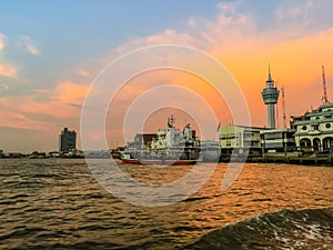 Riverfront view of Samut Prakan city hall with new observation tower and boat pier. Samut Prakan is at the mouth of the Chao