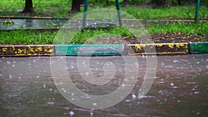 Rivers of water on the asphalt during heavy rain.