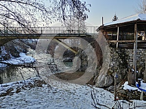 Riverscape view with a bridge and house on winter photo