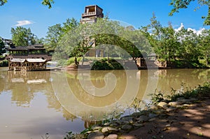 Riverside covered bamboo rafts for sightseeing iin sunny autumn