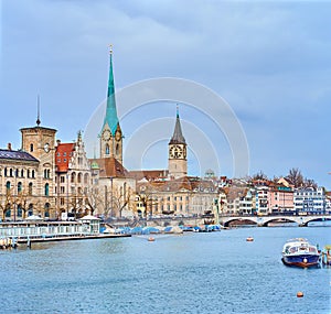 The riverside housing of Limmat river with Peterskirche and Fraumunster churches, Zurich, Switzerland