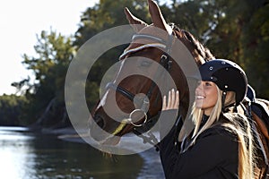 Riverside portrait of rider and horse