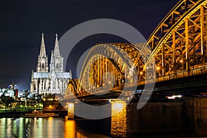 Cologne Cathedral and railway bridge over the Rhine river, Germany