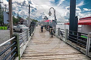 Riverwalk along the waterfront of the Cape Fear River on bike overlooking Memorial Bridge Wilmington, NC