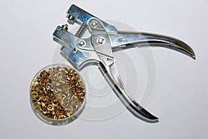 Rivet pliers and eyelets in a small box