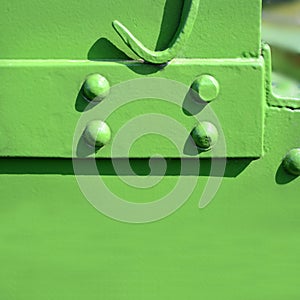 Riveted steel plates with green paint