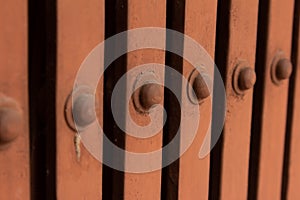 Rivets along the collapsible gate used for additional security for homes and businesses