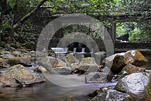 Rivulet and stone bridge in Shing Mun Reservoir photo
