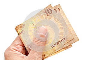 10 Riyal Saudi Arabia money banknotes in hand. photo