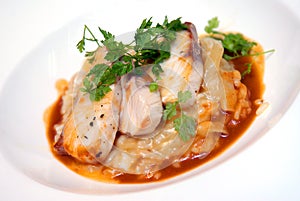 Rizotto with a fried pike perch in sauce