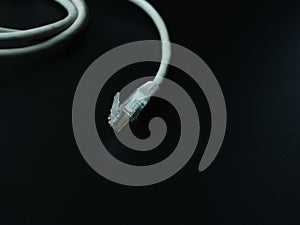 Rj45 cable on dark background.