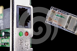 Rj45 cable and network card slot. Cable for data transmission in a computer network