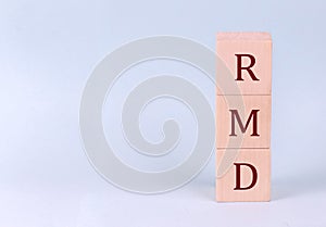 RMD on wooden cubes on a blue background