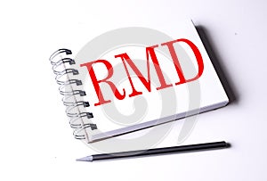 RMD word on notebook on white background photo