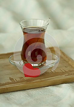 rning turkish tea in traditional glass with red paper heart, breakfast in bed