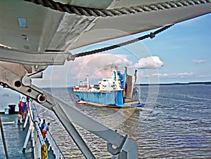 Ro-Ro is a specialized vessel for transporting vehicles, containers and other cargoes in the port and on the high seas.