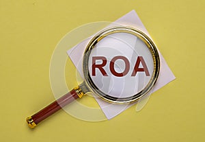 ROA acronym, inscription through magnifying lens