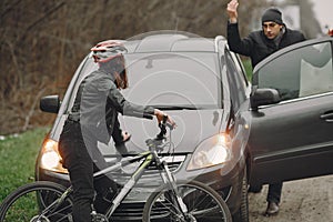 Road accident with cyclist man driver and car