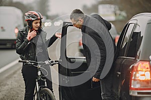 Road accident with cyclist man driver and car